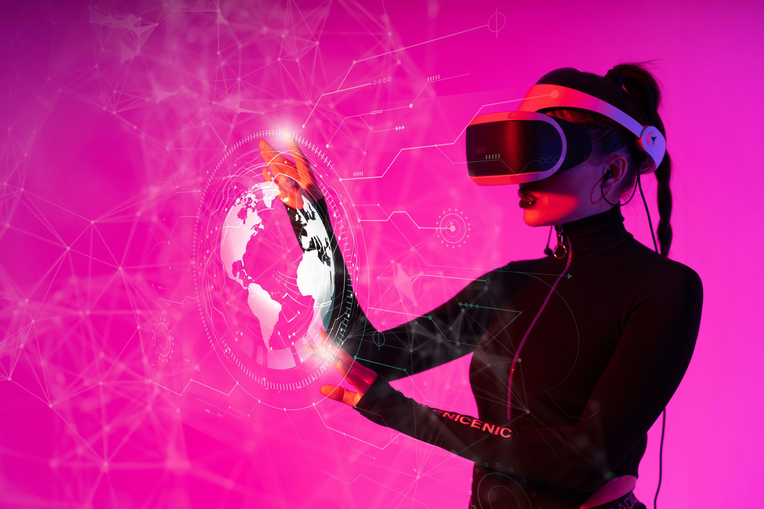 A woman experiencing virtual reality marketing, with a globe illuminated in pink light in the background.